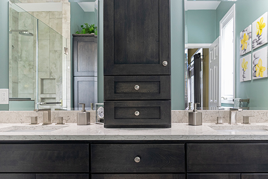 Double sink bathroom remodel with a tower cabinet for stylish storage in your kitchen & bath project.