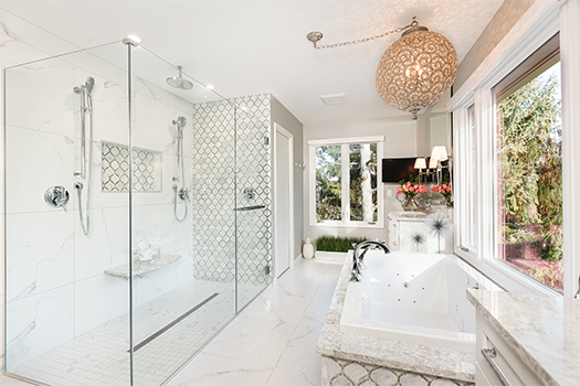 Elegant bathroom design with modern shower, soaking tub, and natural light
